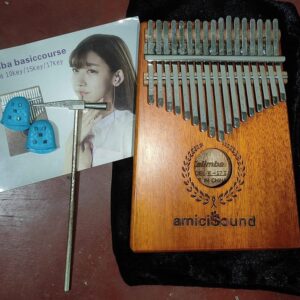 Top-down view of a DELW-17 I Kalimba thumb piano with 17 engraved steel keys on a wooden body