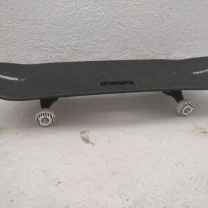 A matte black Jaspo Hurricane Ollie fiber skateboard featuring the Vigour art design on an 8-inch deck.