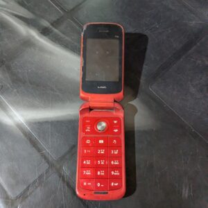 Front view of a Ruby Red Lava Flip Phone in excellent condition, thrifted